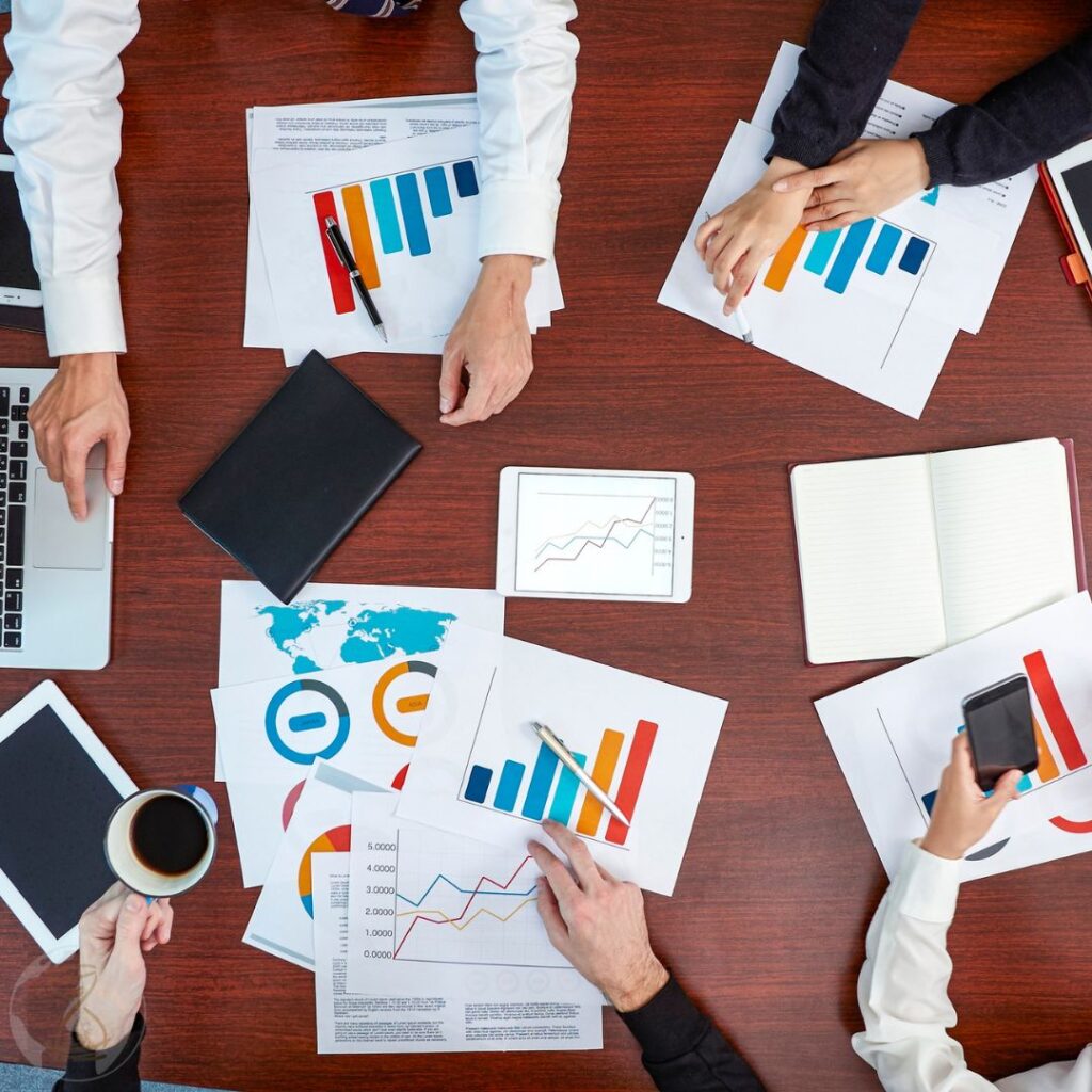 Overview of a Business Meeting with Graphs and Data Analysis